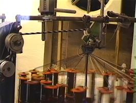 One of the very clever ropemaking machines at The Ropemakers, Hawes, weaving several different-coloured cords into a single rope
